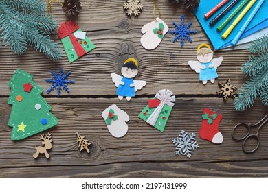 Different Handmade Christmas Toys From Felt With Your Own Hands On Wooden Background. New Years Childrens DIY Concept. Xmas Tree Decoration, Gift Or Greeting Card.