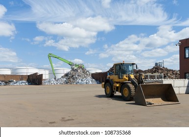 different heaps of metal recycled from car wrecks - Powered by Shutterstock