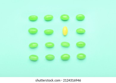 Different Jelly Beans On Color Background. Concept Of Uniqueness