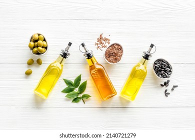 Different kind of cooking oil - sunflower olive and sesame oil with seeds - Shutterstock ID 2140721279