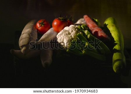 Different kind of local vegitables in the kitchen, Light coming through window. Organic food concept