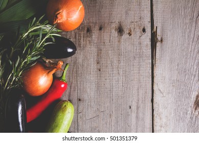 Different kind of local vegitables on the wooden rustic table. Organic food concept. Toned picture