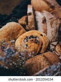 Different Kinds Of Bread And Baked Goods, Placed Into Box In Vintage Style Decorated With Dry Flowers.