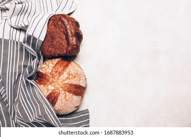 Different kinds of bread on white backdround. Top view, flat lay.