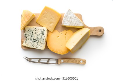 Different kinds of cheeses isolated on white background. Top view.