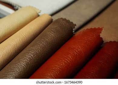 Different leather samples as background, closeup view