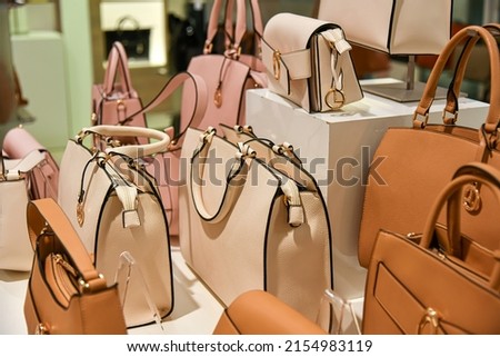 Different leather women's bags for sale in the mall.