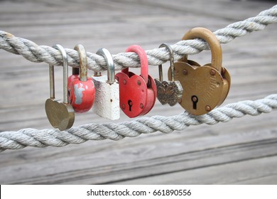 Lot Of Different Love Padlocks On Thick Hemp Rope. The Inscription On The Lock 