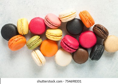 Different macaroons on a light background. Top view