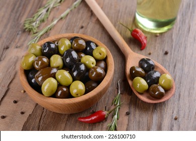 Different marinated olives on table close-up - Powered by Shutterstock