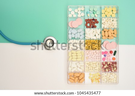 Different medication with stethoscope for background