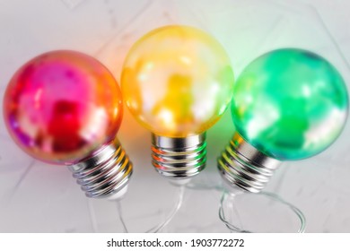 different mindsets and ideas conceptual image, red yellow and green lght bulbs next to each other metaphor of contrasting opinions or attitude