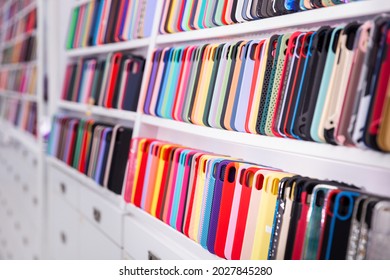 Different Mobile Phone Cases On Shelves In A Multimedia Store