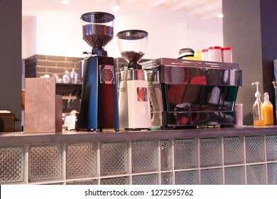 Different Modern Coffee Machines Standing On Bar Counter