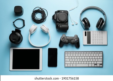 Different modern devices on color background - Shutterstock ID 1901756158