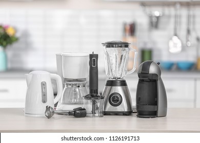 Different modern kitchen appliances on table indoors. Interior element - Shutterstock ID 1126191713