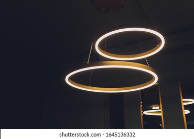 Different modern streamlined mirror copper chandeliers. Bubble metal copper shade pendant.