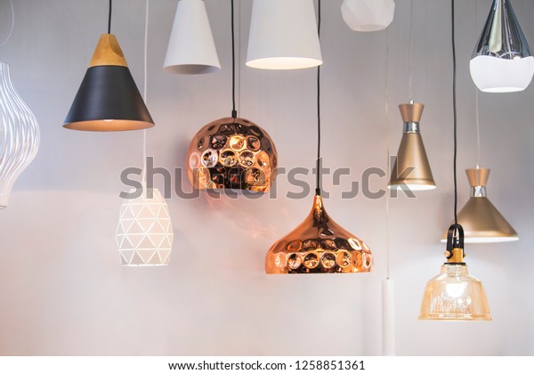 Different modern streamlined mirror copper\
chandeliers. Bubble metal copper shade\
pendant.