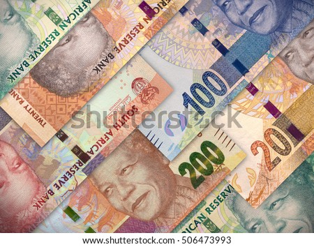 Different money bills stacked over each other forming a money background. 