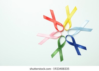 Different multi colored awareness ribbons on white background - Powered by Shutterstock