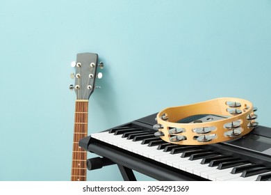 Different Musical Instruments On Color Background, Closeup