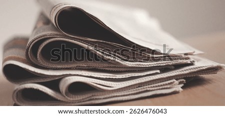  Different newspapers on the table