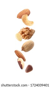 Different Nuts Falling On White Background 