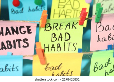 Different Paper Notes Hanging On Ropes, Closeup. Break Bad Habits