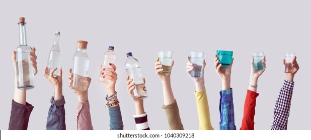 Different People Holding Water Bottles And Glass