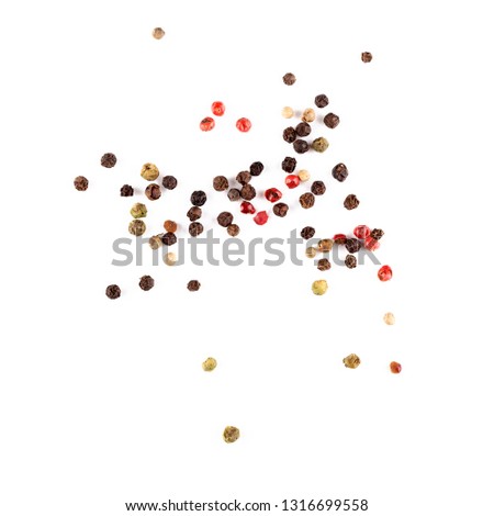 Different pepper mix isolated on white background. Black, red and white peppercorns macro closeup top view