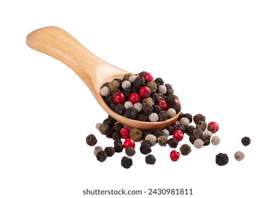 Different peppers in a wooden spoon isolated on a white background with a bunch of peppers. The concept of a mix of spices for cooking