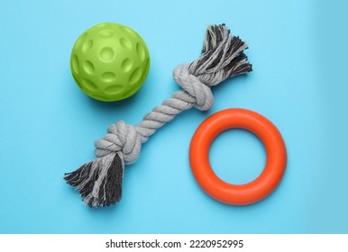 Different pet toys on light blue background, flat lay - Shutterstock ID 2220952995