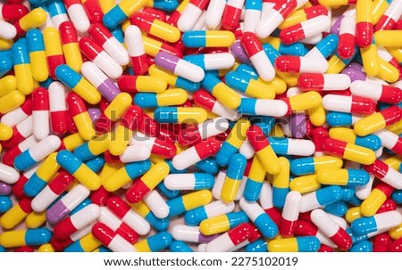 Different pills on beige background, flat lay.