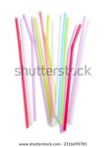 Different plastic straws on white background