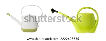 Different plastic watering cans on white background, banner design