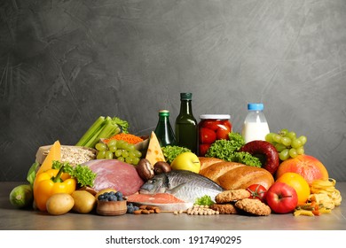 Different products grey table  Healthy food   balanced diet