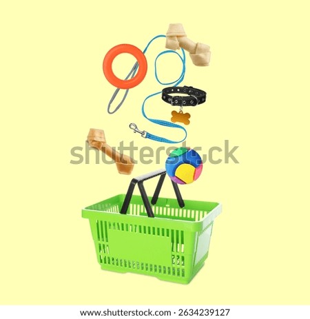 Different products for pets falling into shopping basket on pale yellow background