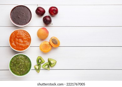 Different puree in bowls and fresh fruits on white wooden table, flat lay. Space for text - Powered by Shutterstock