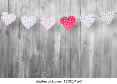 Different Red Heart Shapes Garland On Wood Desk