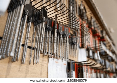 Different replaceable drill consumable tools on hardware store showcase
