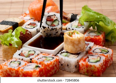 Different rolls  background.  Traditional sushi. Delicious  japanese food. 