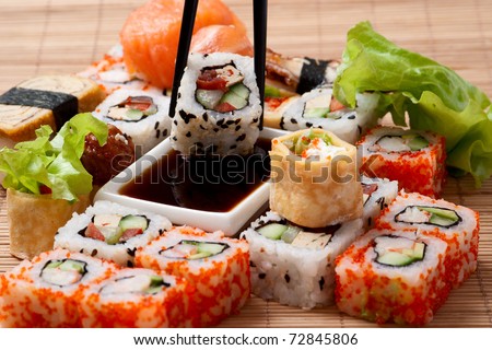 Different rolls  background.  Traditional sushi. Delicious  japanese food. 