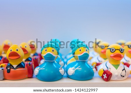 Different rubber ducks on the shelf in the store.