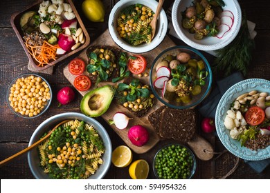 Different Salad And Snack On The Wooden Table Top View