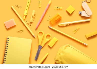 Different school stationery and notebook on orange background - Shutterstock ID 2338165789