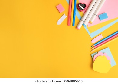 Different school stationery on yellow background, flat lay with space for text. Back to school - Powered by Shutterstock