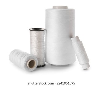 Different sewing thread spools isolated on white background