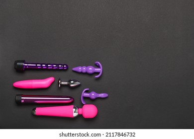 Different sex toys on dark background