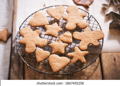 Different shaped gingerbread cookies on cooling rack - Powered by Shutterstock