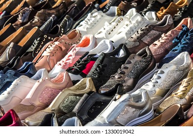 Different shoes on the counter in the market for sale - Shutterstock ID 1330019042